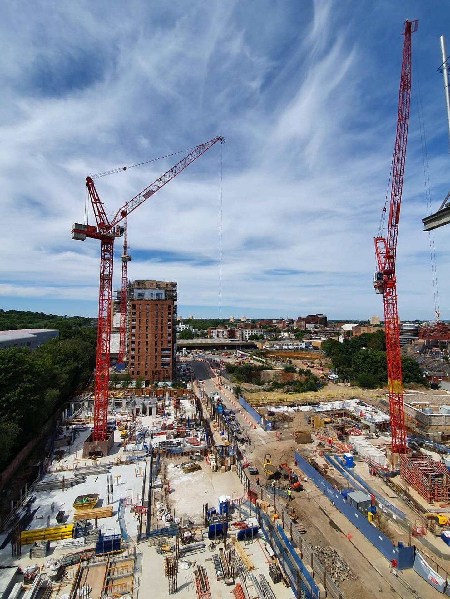 Tower cranes above an HYB project